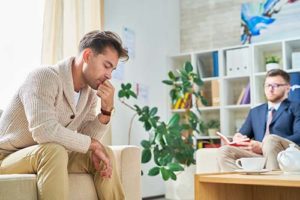 a man talks to a therapist at an lgbtq prescription drug addiction treatment program