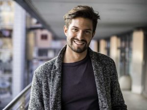 a man smiles as he thinks about the benefits of entering an lgbtq partial hospitalization program in hollywood california