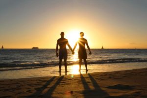 couple on beach glad for sober living california