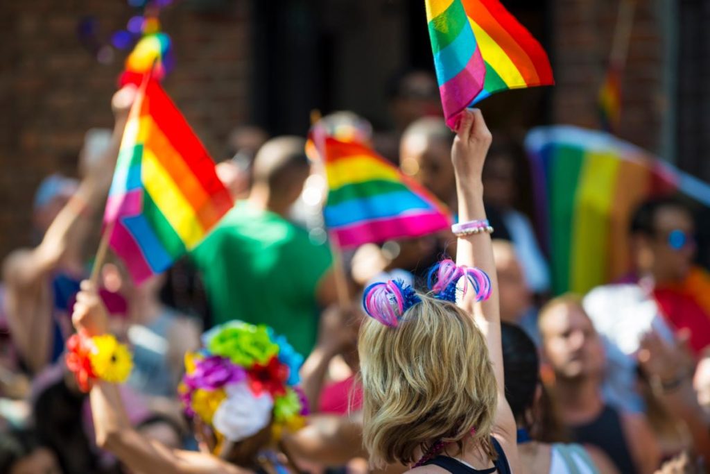 a sea of rainbow pride flags fly possibly before a party with common party drugs