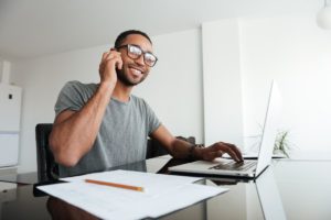 a man on his computer looking up tips for paying for a rehab program