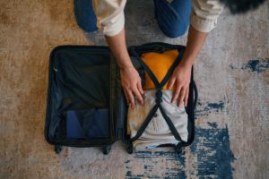 a person packing the best things to bring to rehab