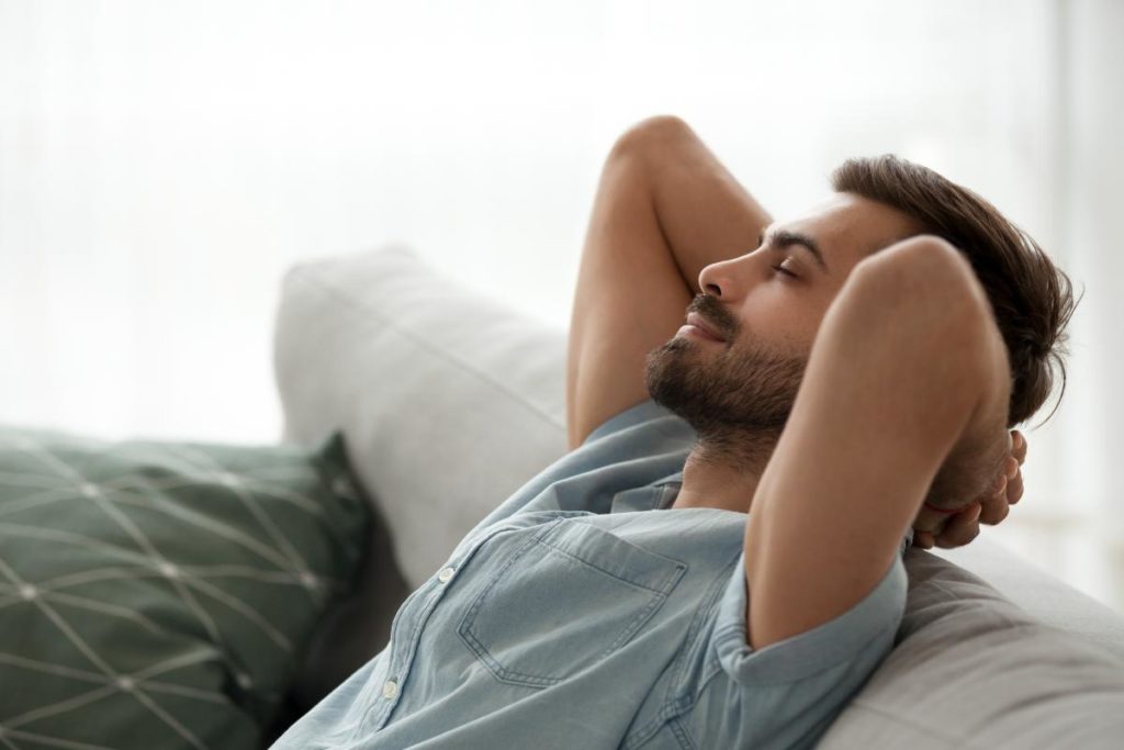 man leaning back on couch in thought who wants to know how does meth you feel