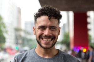 a person smiles after learning about benefits of heroin treatment