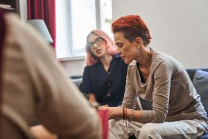 two women in therapy session realizing the benefits of choosing an lgbtq rehab for treatment