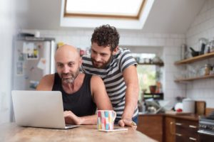 Couple looking at laptop, preparing for a residential treatment program