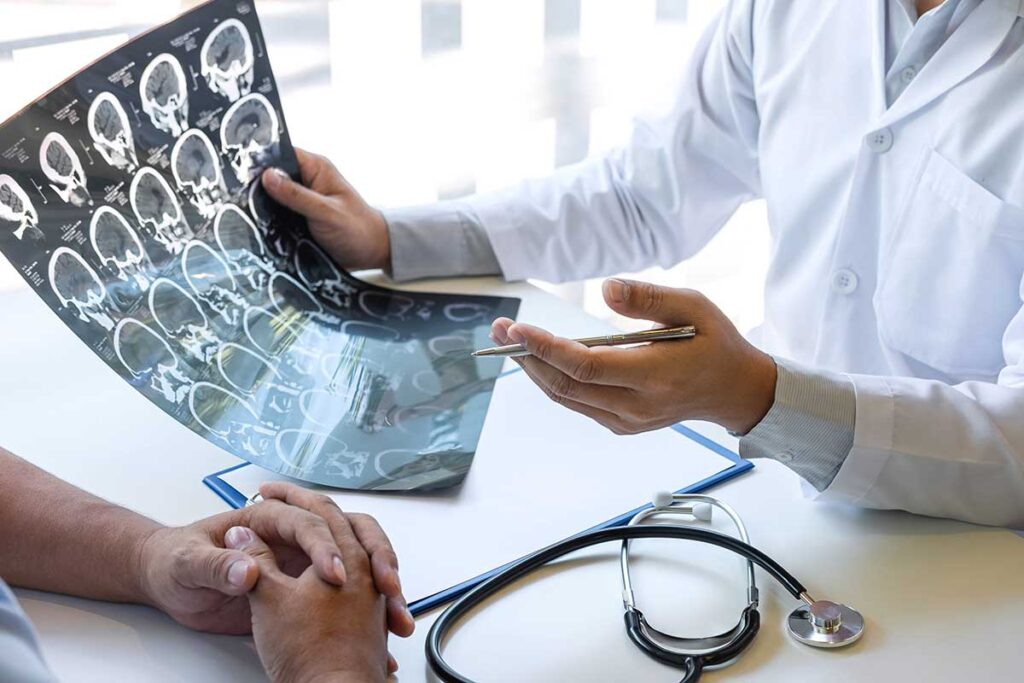 medical professional examining scans detailing ketamine effects on the brain.