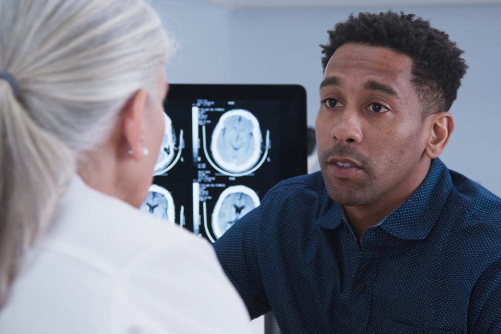 young man asking medical professional what does GHB do to the brain?