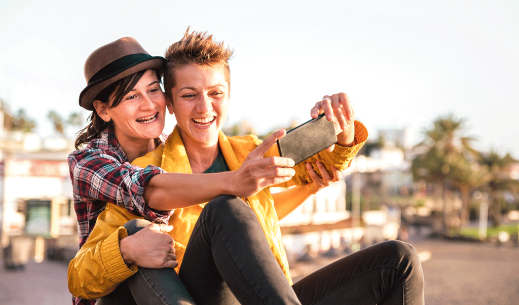 Two LGBTQ+ community members enjoying PRIDE while sober