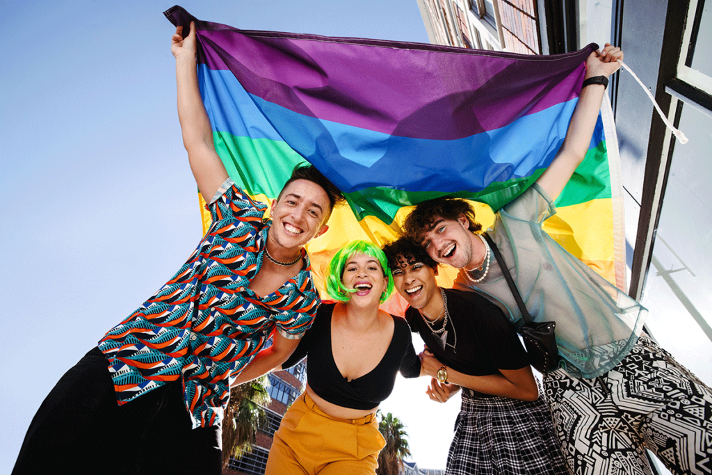 LGBTQ friends celebrating together after learning how to identify peer pressure at PRIDE